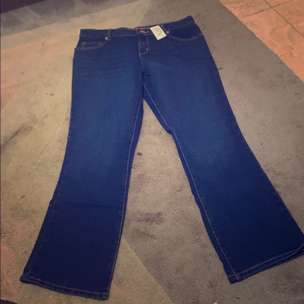 Never worn, still has tags, bootcut jeans, dark